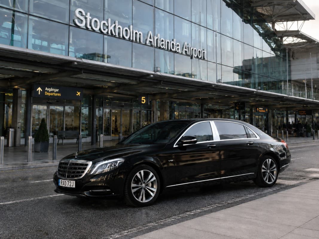 Best airport transfer service in Stockholm — Mercedes-Benz chauffeur waiting at Arlanda Airport