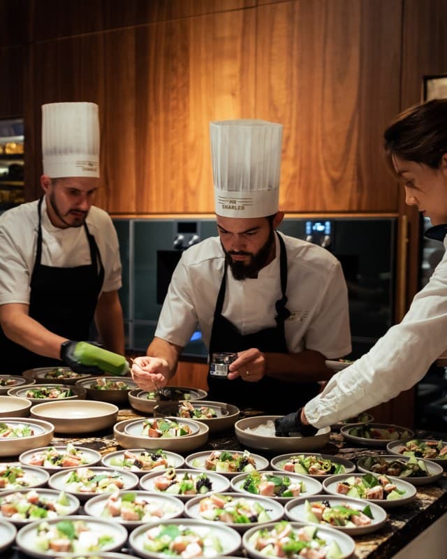 Private chef in Stockholm preparing a bespoke tasting menu for a luxury villa dinner